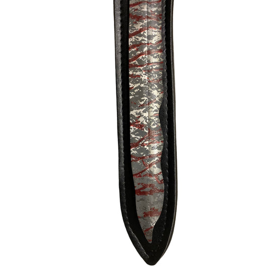 Close-up of a sword with a unique pattern on a white background