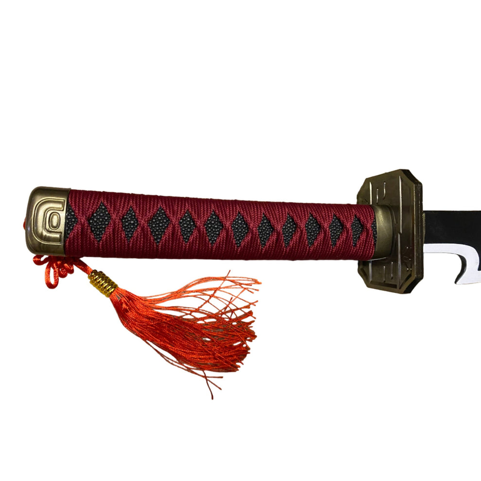 Sword with red tassel and decorative handle on a white background
